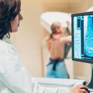 Mammographer reviewing breast images