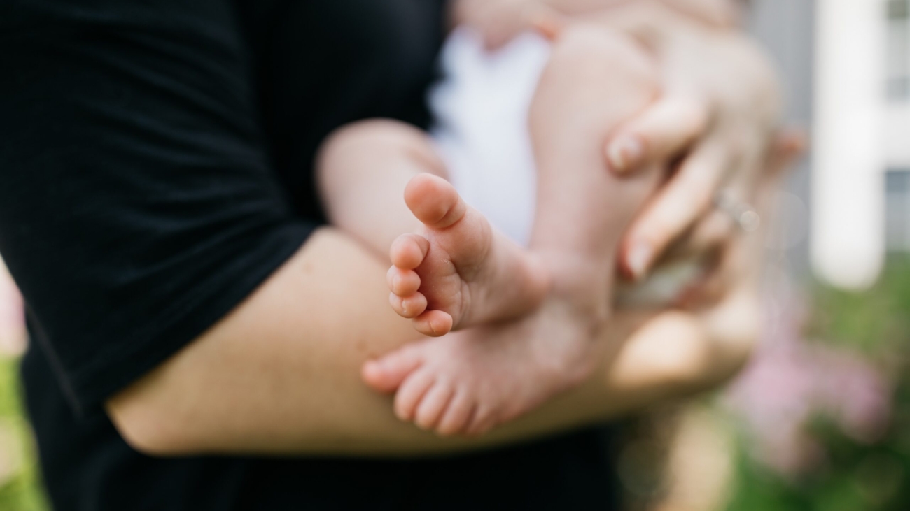 Woman holding a baby breastfeeding